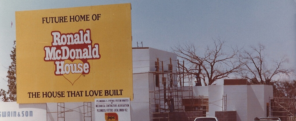 vintage picture of sign telling of future ronald McDonald's house under construction