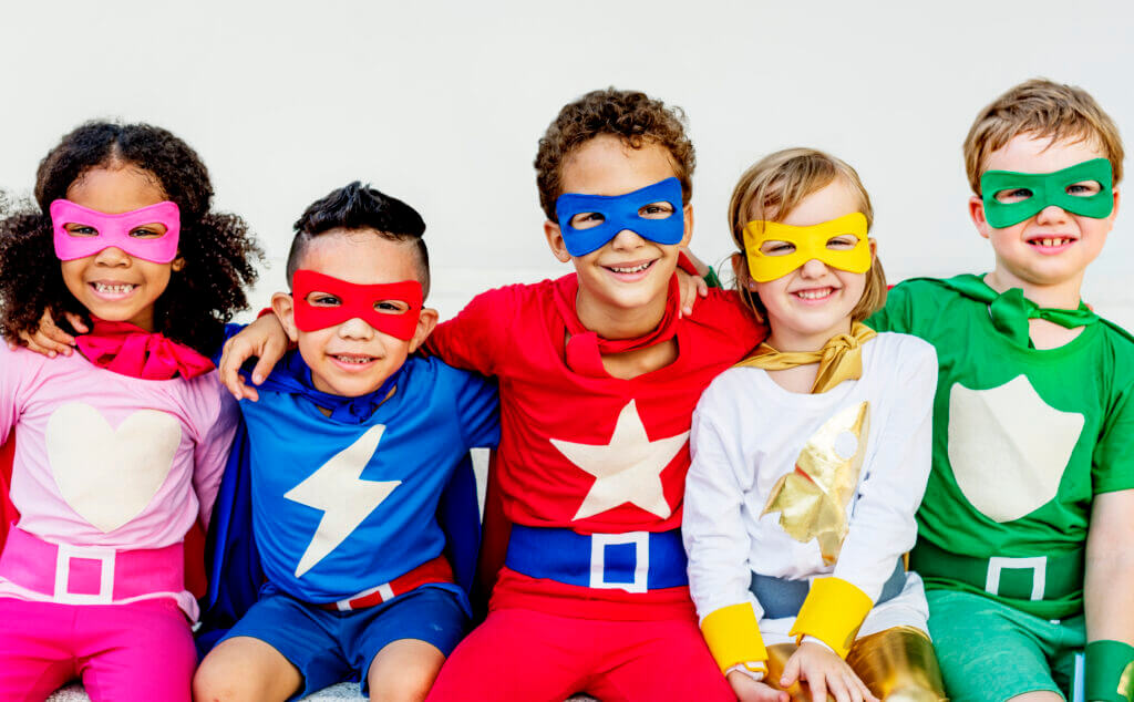 Superheroes Kids Friends Playing Togetherness Concept kids dressed in superhero costumes